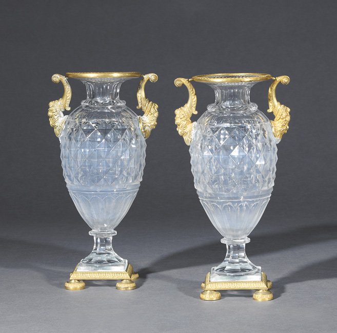 Pair of Restauration Cut Glass Garniture Vases: Pair of Restauration Gilt-Bronze and Cut Glass Garniture Vases, second quarter 19th century, the diamond-cut vases resting on a gilt-bronze foot, with cornucopia-form gilt-bronze handles and finished 