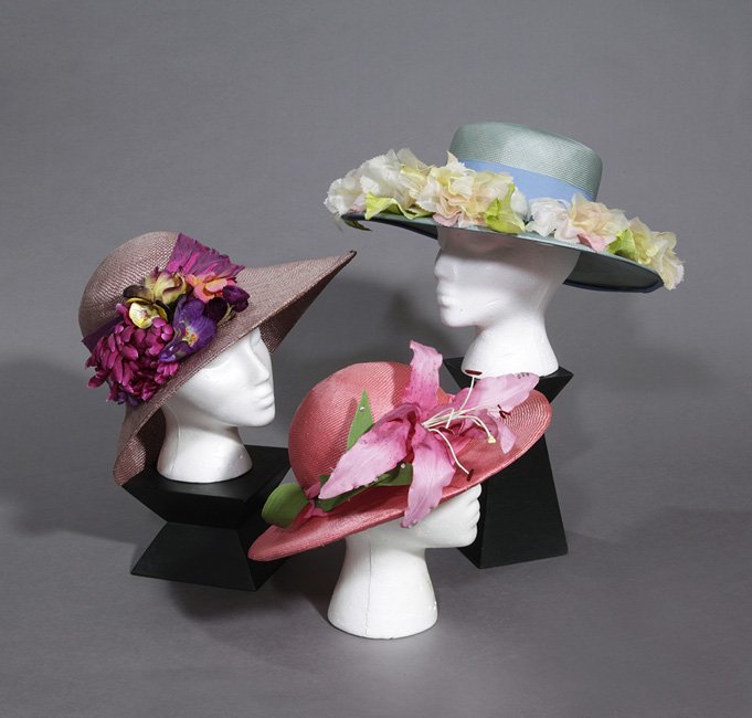 Three Flower-Trimmed Straw Hats: Three Flower-Trimmed Straw Hats, by Eric Javits, Ann Marie and Raymond Hudd.