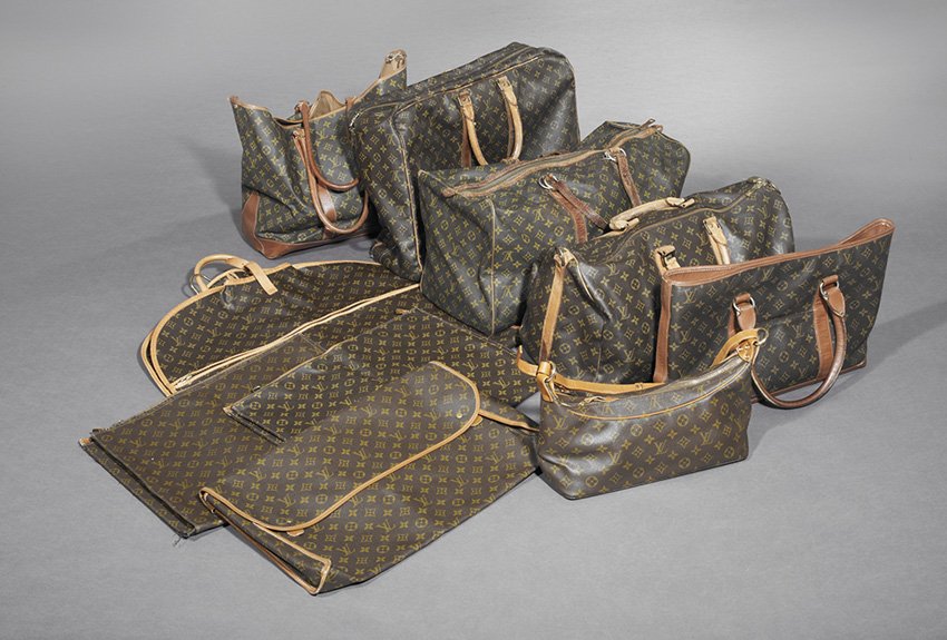 Ten-Piece Collection of Louis Vuitton Luggage: Ten-Piece Collection of Louis Vuitton Luggage, 20th century, including a zippered soft side suitcase, h. 14", w. 22", a hanging suit bag, h. 44", w. 24", three flat pouches, h. 14", w. 20", a tote bag