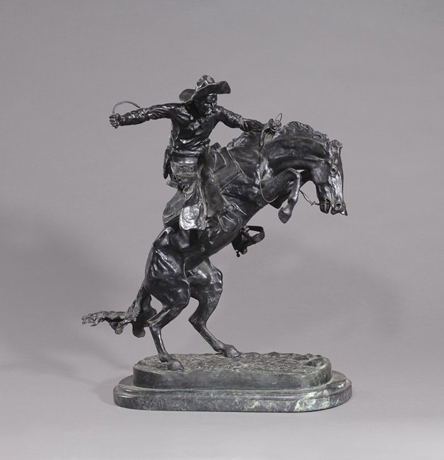 After Frederic Remington (American, 1861-1909): After Frederic Remington (American, 1861-1909), "The Cowboy", 20th century, bronze on a marble base, marked on the base, h. 24", w. 22-3/4", d. 9-3/4".
