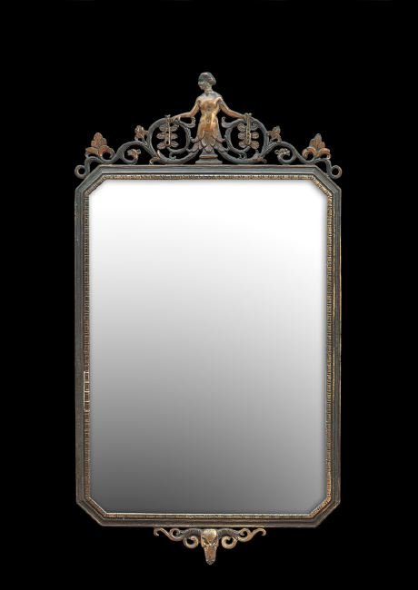 Oscar Bach Art Deco Pierced Bronze Mirror: Oscar Bach, New York, Pierced Bronze Mirror in the Art Deco Style, early 20th century, the patinated frame with polished highlights and pierced scrollwork with stylized leaves and a "flapper", the bac