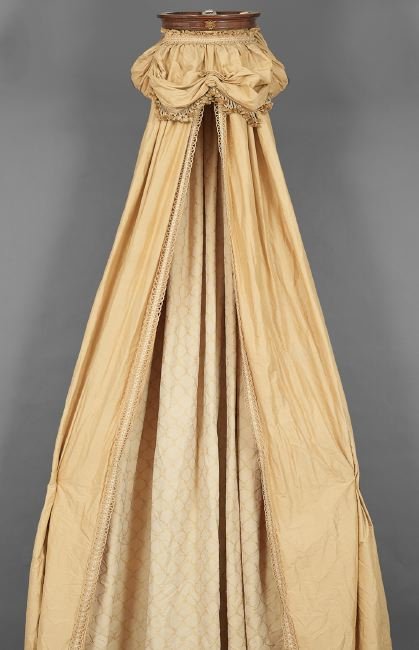 Empire-Style Bronze-Mounted Mahogany Baldachin: Empire-Style Bronze-Mounted Mahogany Baldachin, the bed crown, w. 17-1/2", d. 14", with gold curtains woven in a lattice pattern and trimmed in braid, l. 124", together with a pair of Louis XVI-style 