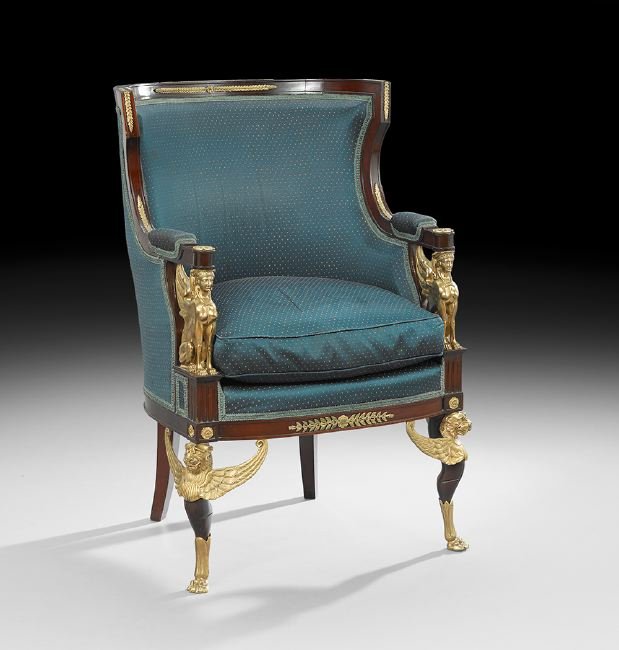 Empire-Style Mahogany Bergere: Empire-Style Mahogany Bergere, early 20th century, the shaped and curved padded back joined by downswept arms on ormolu griffin supports to the cushioned seat, raised on shaped legs headed by winged l