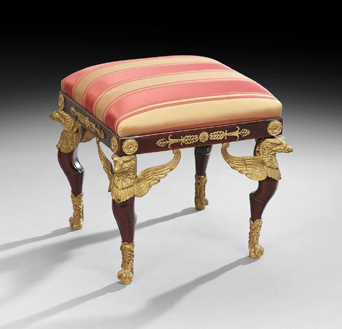 Empire-Style Mahogany and Ormolu Stool: Empire-Style Mahogany and Ormolu Stool, early 20th century, the padded square top raised on shaped legs headed by finely figured ormolu winged eagles and ending in claw feet, h. 19", w. 20", d. 20".