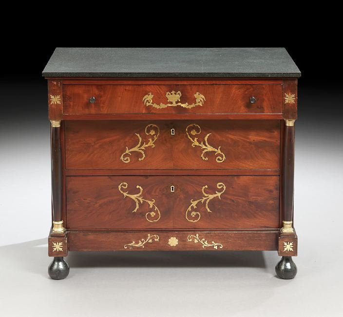 Empire Mahogany and Marble-Top Commode: Empire Mahogany and Marble-Top Commode, early 19th century, the rectangular charcoal marble top above a conforming case fitted with a single frieze drawer over two recessed drawers, flanked to either 