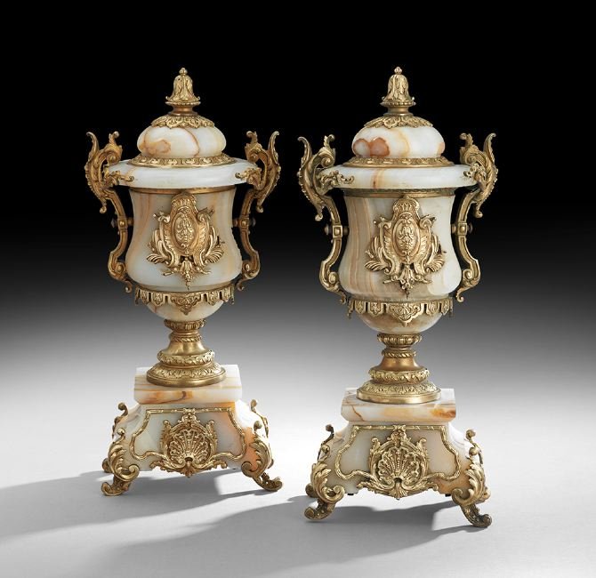 Pair of Continental Alabaster Mantel Garnitures: Pair of Continental Bronze-Mounted Alabaster Mantel Garnitures, ca. 1900, the alabaster urn-form garnitures decorated with bronze trim and handles, the covers with molded bronze knops, raised on bronz