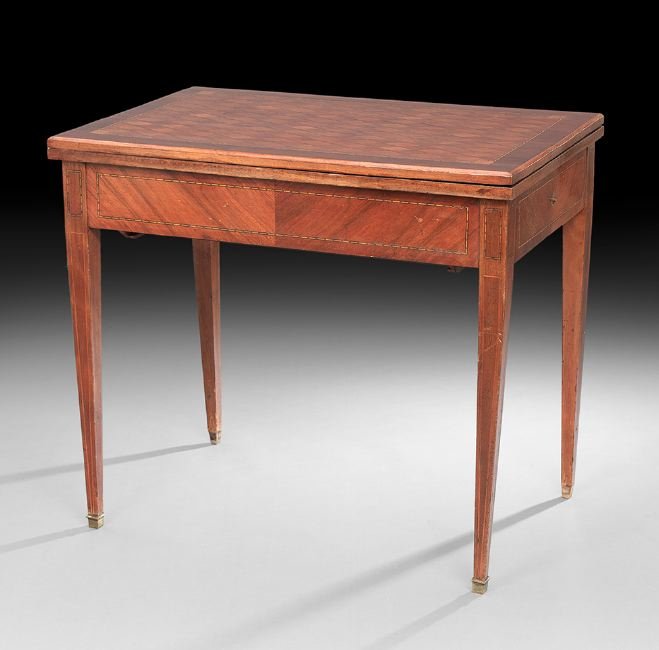 Louis XVI-Style Mahogany and Kingwood Games Table: Louis XVI-Style Mahogany and Kingwood Games Table, early 20th century, the banded parquetry-inlaid top hinged and opening to a baize-lined interior, above a frieze fitted with an end drawer, opening t