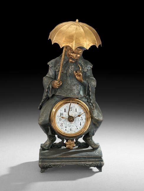 Unusual French Metal Figural Novelty Clock: Unusual French Metal Figural Novelty Clock, fourth quarter 19th century, in the form of a mandarin elder holding a parasol, which serves as the clock's bell, and sitting astride the clock on a Chinese