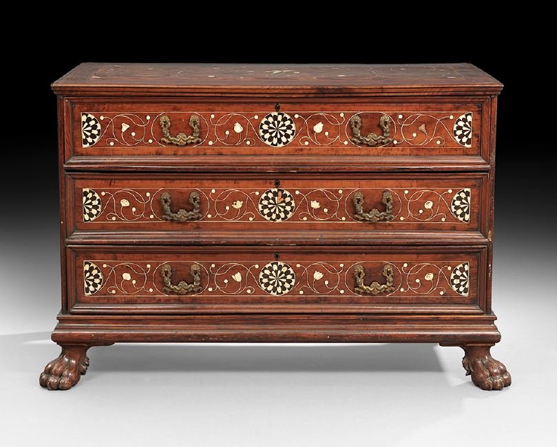 Italian Walnut Commode: Italian Walnut Commode, early 19th century, the rectangular top banded and with inlaid scrolling and geometric patterns in ebony and bone, above a conforming case fitted with three long drawers, all p