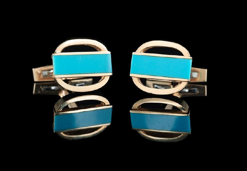 David Webb 18 Kt. Gold and Turquoise Cufflinks: David Webb Eighteen-Karat Yellow Gold and Turquoise Cufflinks, the heavy oval cufflinks each set with a 7.0 mm x 20.0 mm rectangular turquoise band, marked "Webb 18K", 24.8 grams total weight.