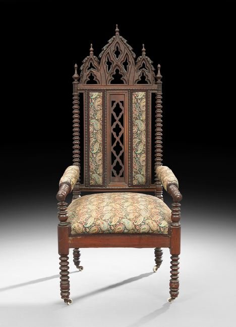 American Gothic Revival Walnut Armchair: American Gothic Revival Walnut Armchair, mid-19th century, with triple peaked crest with quatrefoil piercing and carved details, and bobbin-turned legs, arms and back posts, h. 54", w. 23", d. 25".