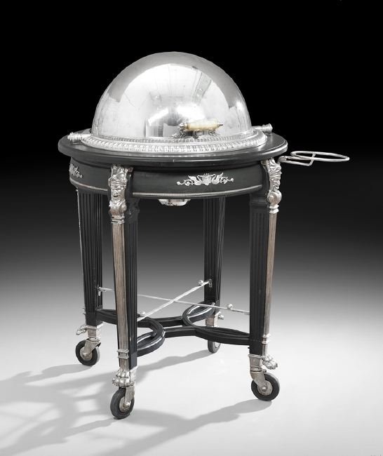 Silverplate and Ebonized Wood Serving Trolley: Silverplate and Ebonized Wood Serving Trolley, contemporary, in the Second Empire taste, the hemispherical silverplate dome revolving to reveal a detachable silverplate platter and plastic diffuser ab