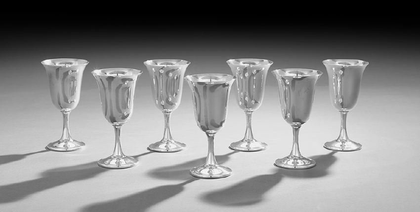 Seven American Sterling Silver Water Goblets: Set of Seven American Sterling Silver Water Goblets, mid-20th century, by Wallace Silversmiths, Wallingford, Connecticut, each with an inverted bell-form bowl, and trumpeting stem to an ogee-domed foo