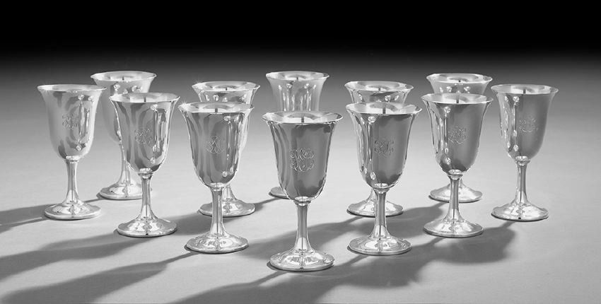 Twelve American Sterling Silver Water Goblets: Set of Twelve American Sterling Silver Water Goblets, mid-20th century, by Wallace Silversmiths, Wallingford, Connecticut, each with an inverted bell-form bowl, and trumpeting stem to an ogee-domed fo