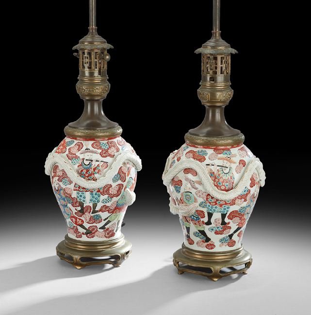 Pair of Franco-Japanese Moderator Lamps: Pair of Franco-Japanese Porcelain and Bronze Moderator Lamps, fourth quarter 19th century, the bronze Asian-style bases supporting the Japanese Imari-style lamp bases, decorated with molded dragons, w