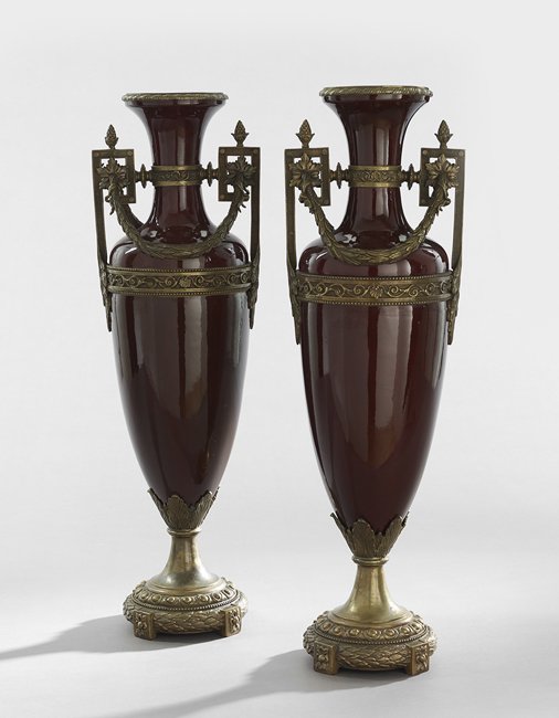 Pair of French Bronze & Porcelain Garniture Urns: Pair of Large French Bronze and Porcelain Garniture Urns, first quarter 20th century, the Etruscan-style oxblood vases mounted with neoclassical-style bronze fittings in the Louis XVI taste, h. 29", d