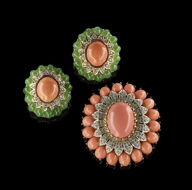 Two Pieces of Simulated Coral Fashion Jewelry: Two Pieces of Simulated Coral Fashion Jewelry, in the manner of Van Cleef & Arpels, goldtone and crystal, including a Panetta brooch, l. 2-1/4", and Ciner ear clips with simulated emeralds, l. 1-1/2".