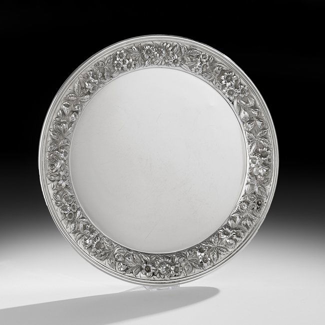 S. Kirk & Son Sterling Silver Salver: S. Kirk & Son Sterling Silver Salver mid-20th century, Baltimore, Maryland, of circular form, the rim decorated with deep repousse flowers in the traditional Baltimore taste, with molded edge, dia. 12