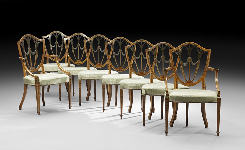 Suite of Eight Edwardian Satinwood Dining Chairs: Suite of Eight Edwardian Satinwood Dining Chairs early 20th century, in the Adam taste, consisting of two armchairs and six sidechairs, each with a shield-form back with polychrome lotus, foliate and 