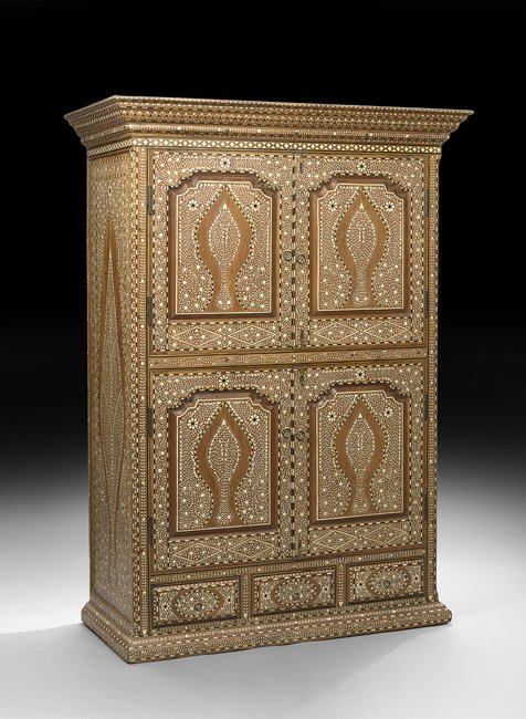 Indian Hardwood and Bone-Inlaid Cabinet: Indian Hardwood and Bone-Inlaid Cabinet the heavily molded cornice above a case fitted with two cupboard doors over two cupboard doors, all inset with shaped and molded panels, with three small drawer