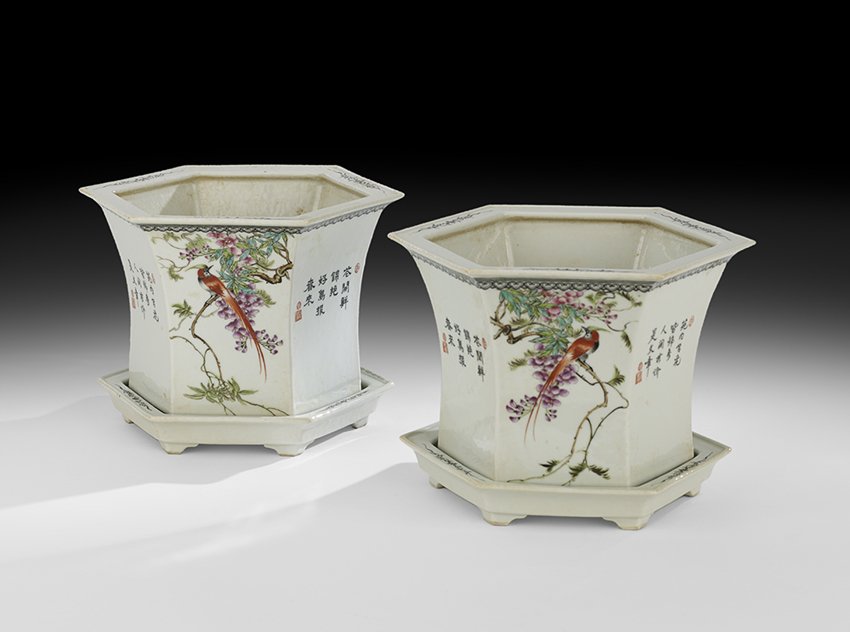 Pair of Chinese Jardinieres and Underplates: Pair of Chinese Porcelain Jardinieres and Underplates late Qing Dynasty (1644-1911), the two pots enameled in a famille rose palette, three sides with arrangements of birds and flowers, wisteria, peon