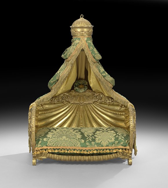 Opulent Continental Giltwood Pet's Bed: Opulent Continental Giltwood Pet's Bed 20th century, in the grotto taste, the crown cornice issuing elaborate drapery continuing to the beaded shell-form bed, each end with elaborate foliate carving, 
