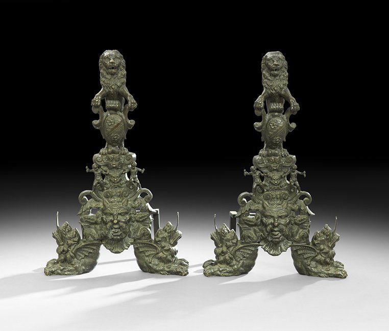 Pair of Bronze Andirons in the Renaissance Taste: Pair of Bronze Andirons in the Renaissance Taste fourth quarter 19th century, probably Continental, lushly decorated with masques of devils and putti, and standing lions grasping a heraldic shield as 