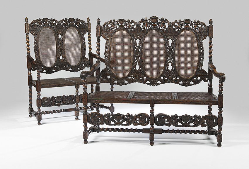 Suite of Two Carolean-Style Mahogany Settees: Suite of Two Carolean-Style Mahogany Settees early 20th century, one a double-back and the other a triple-back, each with urn-form crests flanked by putti, over caned oval backs, joined by scrolling a