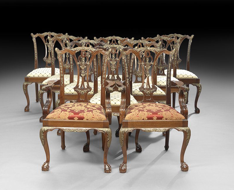 Ten George III-Style Mahogany Dining Chairs: Suite of Ten George III-Style Mahogany Dining Chairs in the manner of Thomas Chippendale, consisting of two armchairs and eight sidechairs, all with an earred and shaped foliate-carved crest above a p