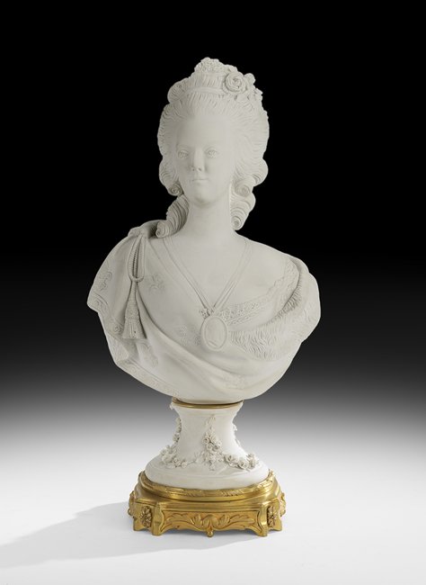 Parian and Gilt-Bronze Bust of Marie Antoinette: Parian and Gilt-Bronze Bust of Marie Antoinette ca. 1900, after Felix Lecomte (French, 1737-1817), the figure wearing a locket with the face of Louis XVI, on a bronze base, the socle decorated with ap