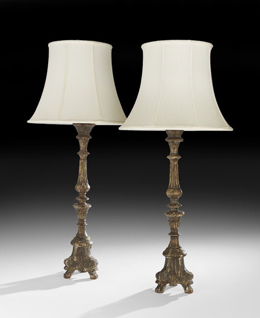 Pair of Italian Baroque Giltwood Altar Sticks: Pair of Italian Baroque Giltwood Altar Sticks ca. 1800, now mounted as lamps, the turned and reeded standards above tripartite bases, mounted with shades, base, h. 26", overall, h. 38", dia. 18".