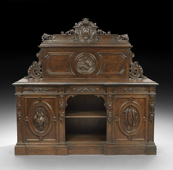 American Rococo Revival Oak Sideboard: Impressive American Rococo Revival Carved Oak Sideboard, Attributed to Alexander Roux, New York third quarter 19th century, with an elaborate carved crest above a paneled backboard with carved birds,