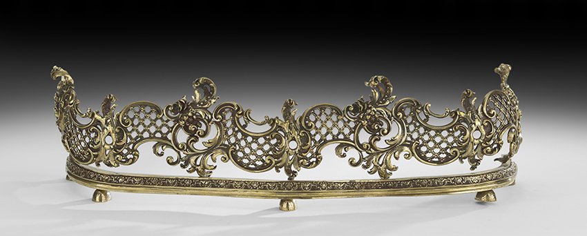 Louis XV-Style Brass Fire Fender: Louis XV-Style Brass Fire Fender, second quarter 20th century, of serpentine form, pierced with scrollwork and diapering, h. 8-3/4", w. 31-1/2", d. 9".