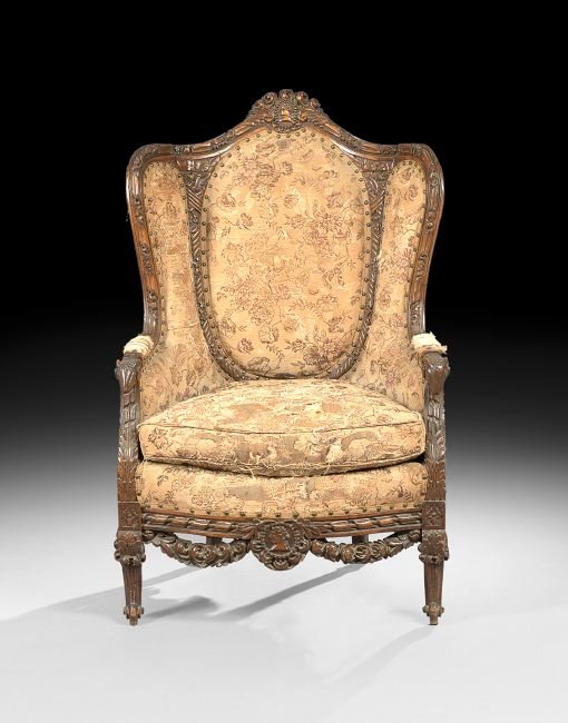 Napoleon III Fruitwood Bergere Avec Orielles: Napoleon III Fruitwood Bergere Avec Orielles, third quarter 19th century, in the Louis XVI taste, the padded medallion back surmounted by a floral portrait medallion crest, and joined to the cushioned