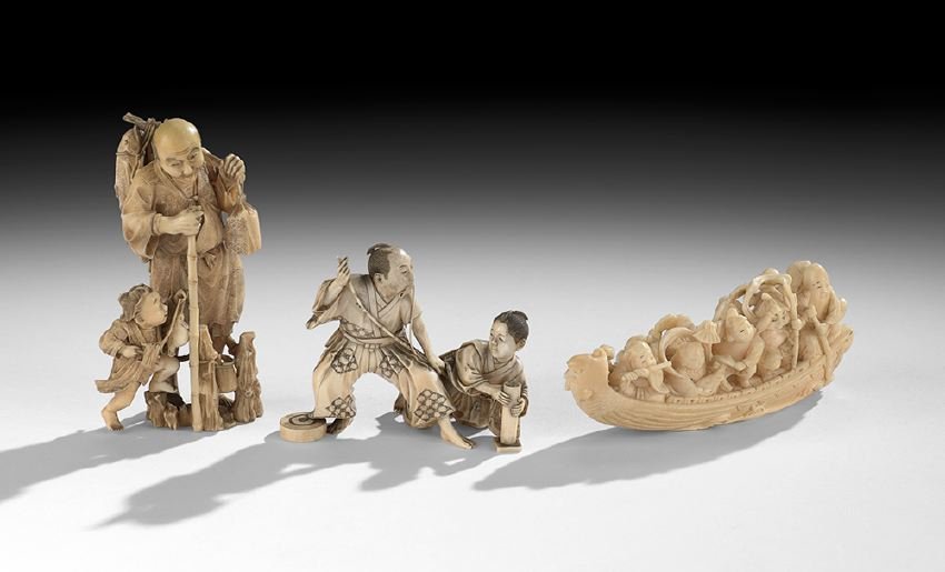 Group of Three Japanese Carved Ivory Okimonos: Group of Three Japanese Carved Ivory Okimonos, Meiji period (1862-1912), one of a man stringing a bow with a young male attendant, one of an old man teaching a child to fish, and the third a carving o