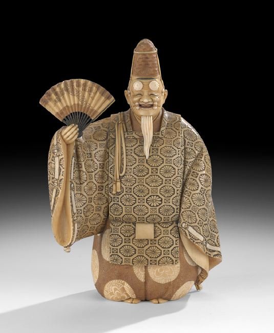 Japanese Antique Carved Ivory Figure of an Actor: Japanese Antique Carved Ivory Figure of an Actor, 19th century, the tinted and finely carved figure holding a folding fan with pine tree decoration in his right hand, wearing a tall hat and an Okina N