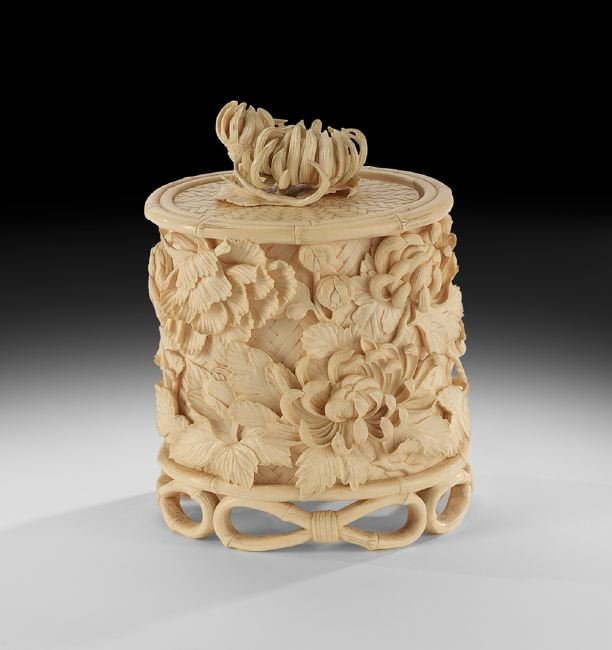 Fine Japanese Antique Ivory Chrysanthemum Box: Fine Japanese Antique Ivory Chrysanthemum Box, 19th century, the vessel with finely carved blooming chrysanthemum flowers on the lid, the body with a motif of carved peonies against wicker, the base r