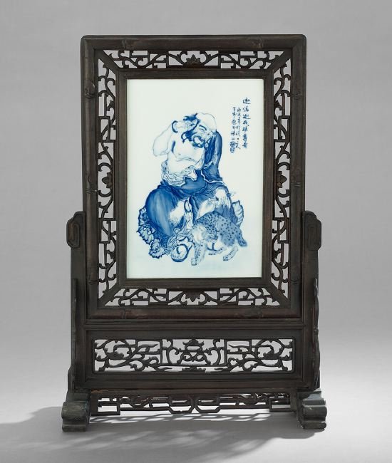 Chinese Porcelain Table Screen: Chinese Porcelain Table Screen, 20th century, with a blue and white image of a sage, inscribed in the upper right, presented in a reticulated wood frame, h. 26-1/2", w. 17-3/4".