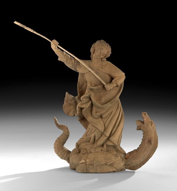 Latin American Santos Figure of Saint George: Latin American Carved Santos Figure Depicting Saint George, first quarter 20th century, the figure modeled standing atop the dragon, poised in battle with his spear, h. 25-1/2", w. 20-1/2", d. 6-3/4".