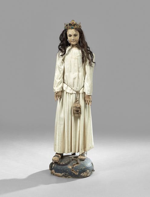 Latin American Wood and Composition Santos Doll: Latin American Articulated Wood and Composition Santos Doll, mid-19th century, depicted in sandals, a snake at feet, h. 47", w. 11-1/2", d. 9-1/2". This example includes a robe, wig and crown, which w