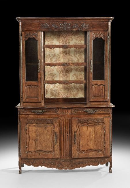 French Provincial Oak Vasselier: French Provincial Oak Vasselier, mid-19th century, the molded rounded rectangular cornice above a conforming case fitted with a floral-carved frieze over three open central shelves flanked to either s
