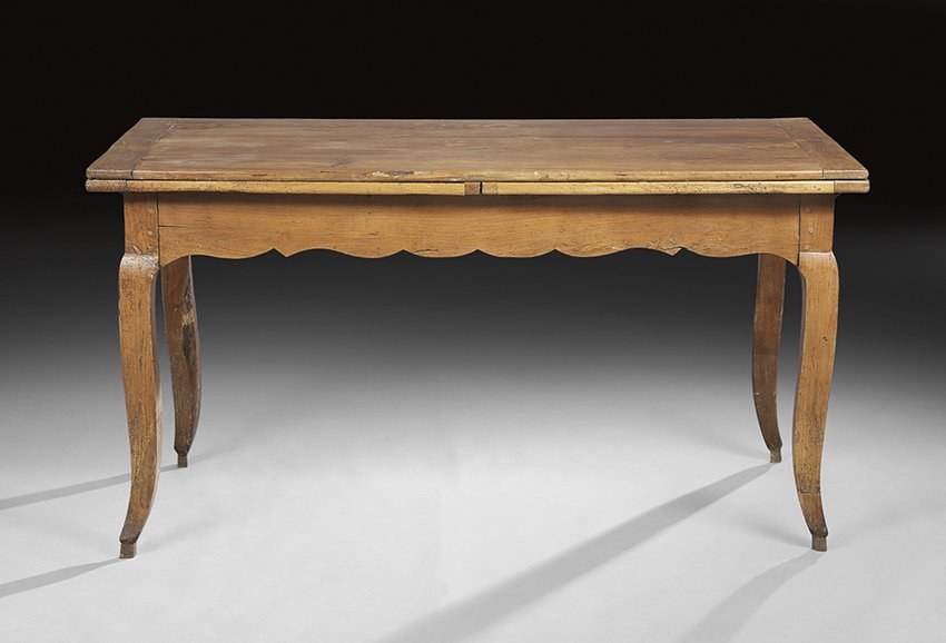 French Provincial Cherry Wood Draw-End Table: French Provincial Cherry Wood Draw-End Table, early 19th century, the banded rectangular top with two like draw ends, above a shaped apron, raised on cabriole legs ending in pointed toes on pegs, h. 3