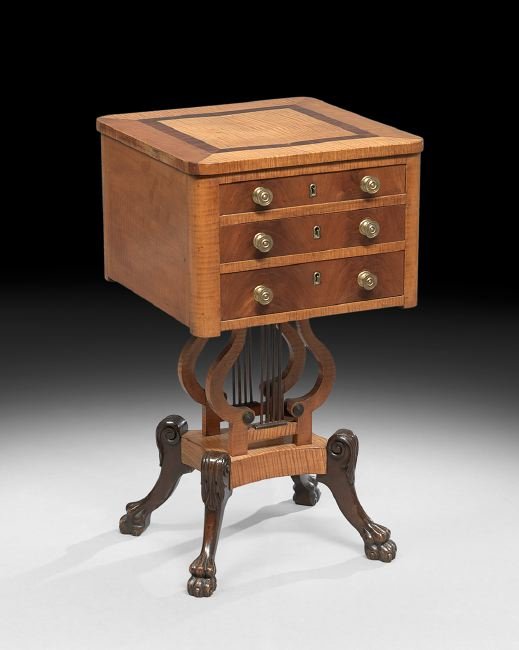 American Classical Maple and Mahogany Work Table: American Classical Figured Maple and Mahogany Work Table, first quarter 19th century, the figured maple top with inlaid mahogany banding over three drawers with flame mahogany-veneered faces, with a l