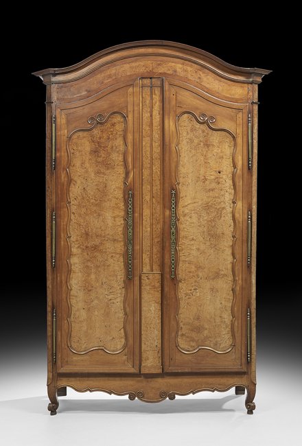 French Provincial Fruitwood Armoire: French Provincial Fruitwood Armoire, mid-19th century, the domed and molded cornice with projecting canted corners, above a conforming case fitted with a paneled frieze over two long doors, each inset