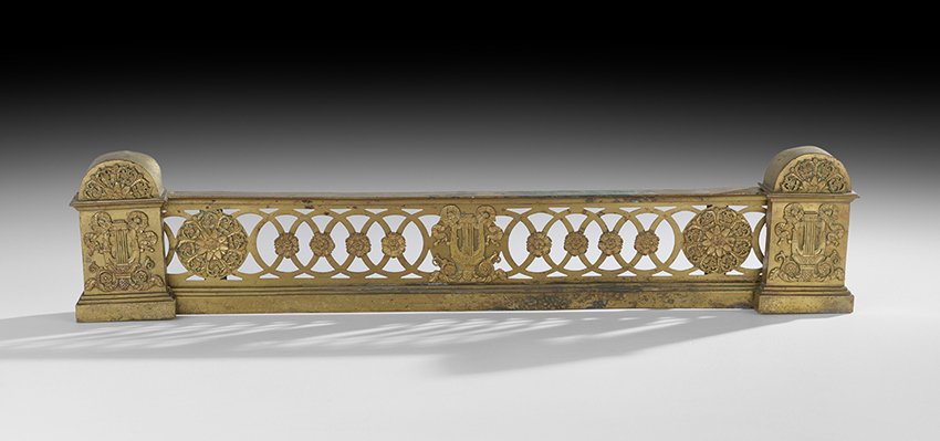 French Restauration Bronze Dore Adjustable Fender: Handsome French Restauration Bronze Dore Adjustable Fender, second quarter 19th century, the arched ends decorated with mounts of lyres and lunettes, and the pierced center rail with medallions and an