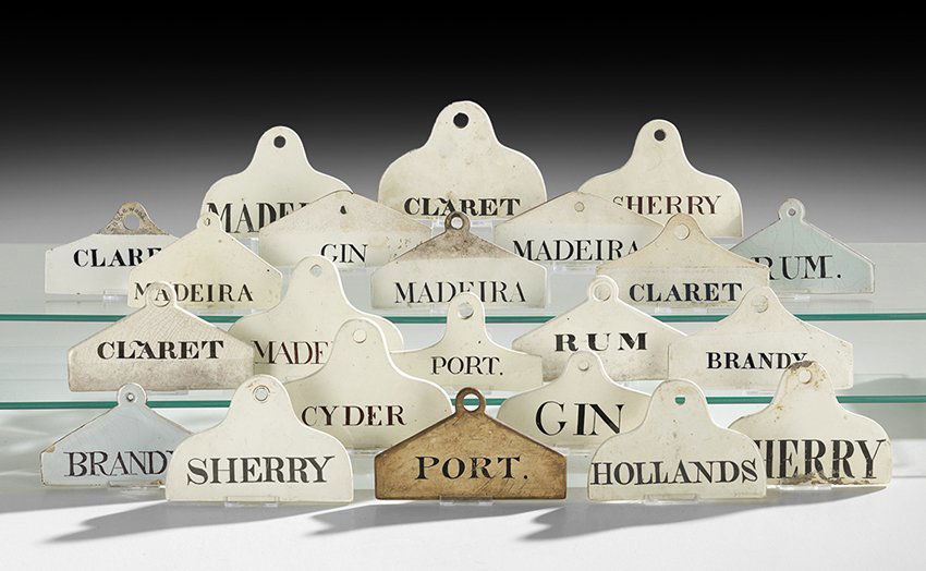 Twenty-Two English Pottery Wine Cask Labels: Collection of Twenty-Two English Pottery Wine Cask Labels, 18th/19th century, including a rare pair of tin-glazed Delft "Rum" and "Brandy" labels printed in mulberry, and two marked "Wedgwood" in uppe