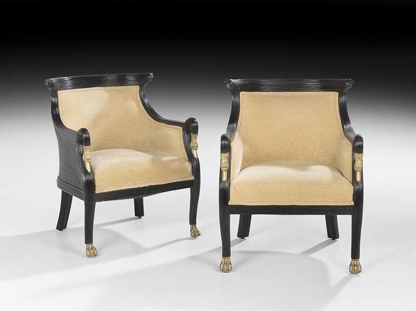 Pair of Empire-Style Ebonized Bergeres: Pair of Empire-Style Ebonized Bergeres, 20th century, each with a curved and ribbed crest above a padded back and downswept sides, with swan's neck hand rests, the padded seat raised on tapering ribbe