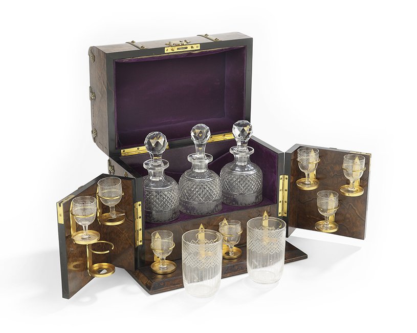 English Burr Walnut Fitted Bottle Case: English Burr Walnut Fitted Bottle Case, mid-19th century, decorated with gilt-brass Elizabethan Revival strapwork, the aubergine velvet-lined interior with fittings for glasses, some included, and thr