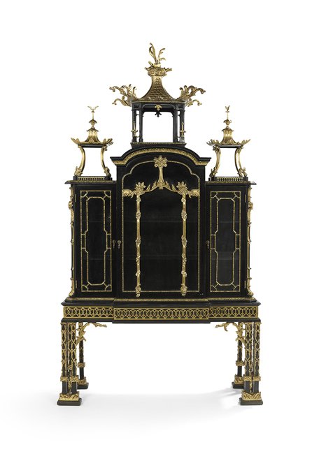 Replica of the Chippendale Kenure Cabinet: Monumental Ebonized and Parcel-Gilt Replica of Thomas Chippendale's Kenure Cabinet on Stand in the Chinese Chippendale Taste, 20th century, with a large open pagoda-form structural crest flanked to e