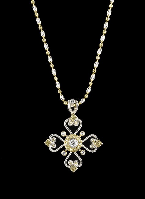 18 Kt. Gold and White/Yellow Diamond Pendant: Eighteen-Karat White/Yellow Gold and White/Yellow Diamond Pendant with Chain, the beaded pendant with open scrollwork mounted with a central bezel-set round brilliant-cut white diamond, with an approx